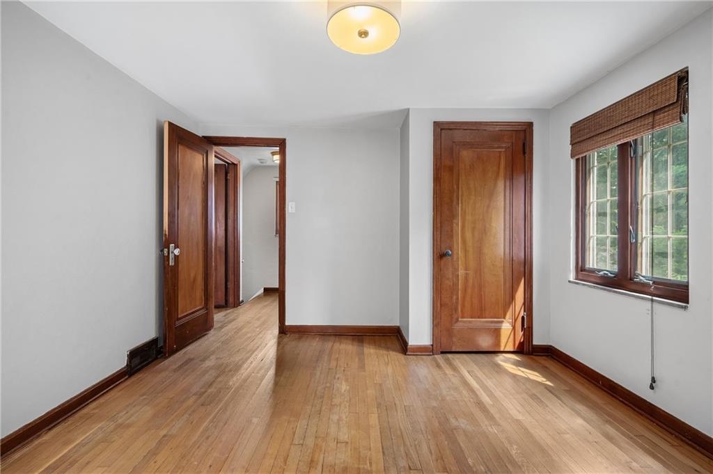 3729 Baytree Street Pittsburgh, PA 15214 - Photo 19 of 30 an empty room with wooden floor and windows