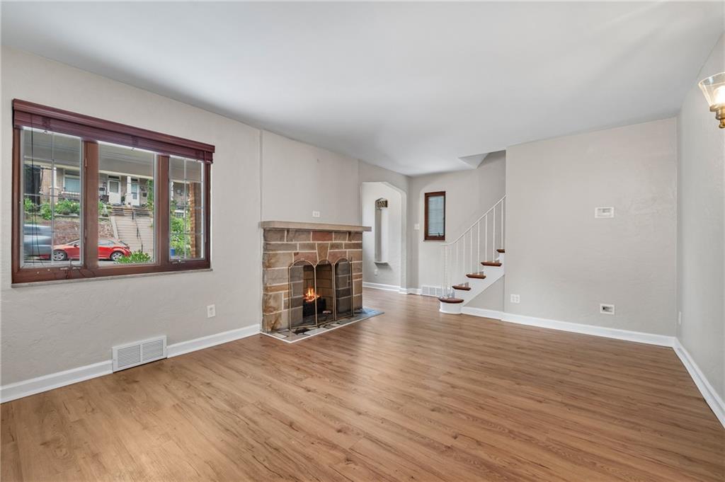 3729 Baytree Street Pittsburgh, PA 15214 - Photo 2 of 30 wooden floor in an empty room with a fireplace