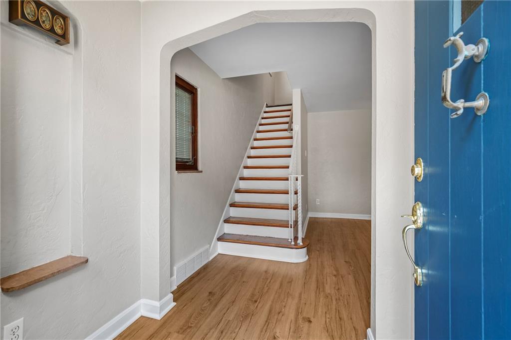 3729 Baytree Street Pittsburgh, PA 15214 - Photo 3 of 30 a view of a hallway with wooden floor and staircase