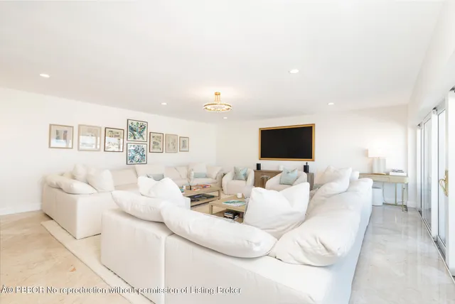 a bed room with large bed and a couch