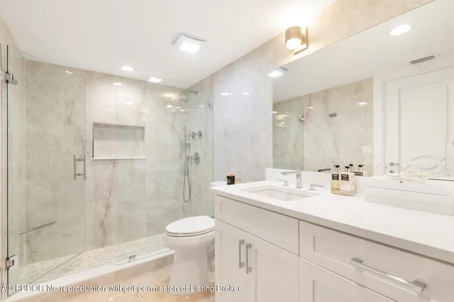 a bedroom with a bed and a television