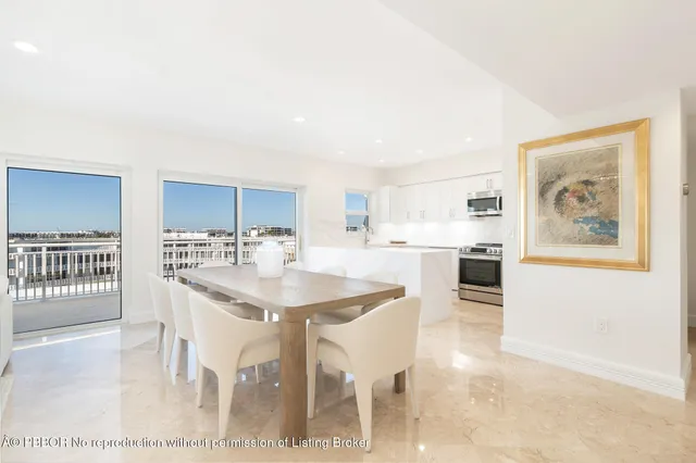 a kitchen with stainless steel appliances kitchen island granite countertop a sink and cabinets