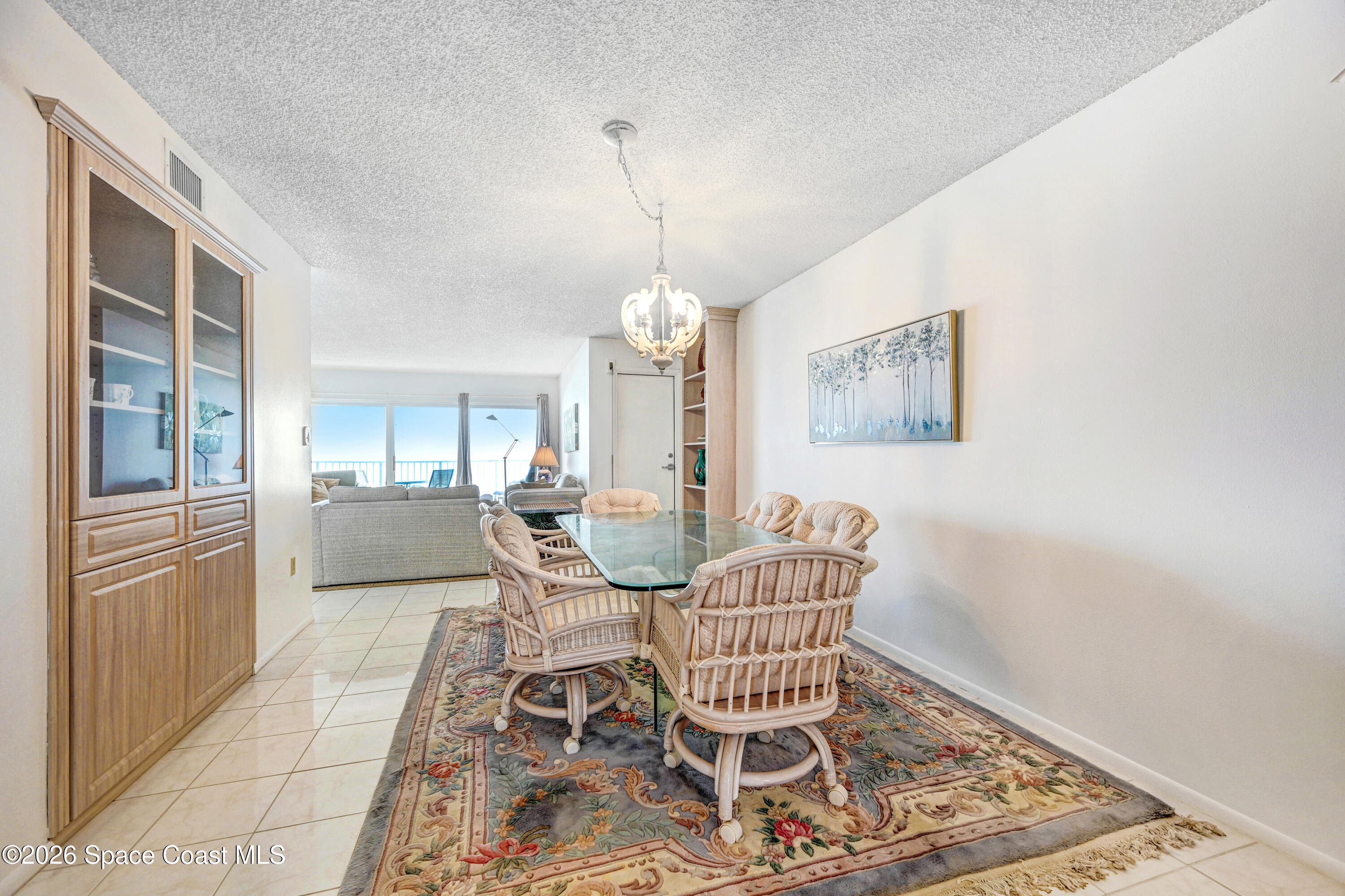2101 Atlantic Street, Unit 533 Melbourne Beach, FL 32951 - Photo 13 of 51 a dining room with furniture and window
