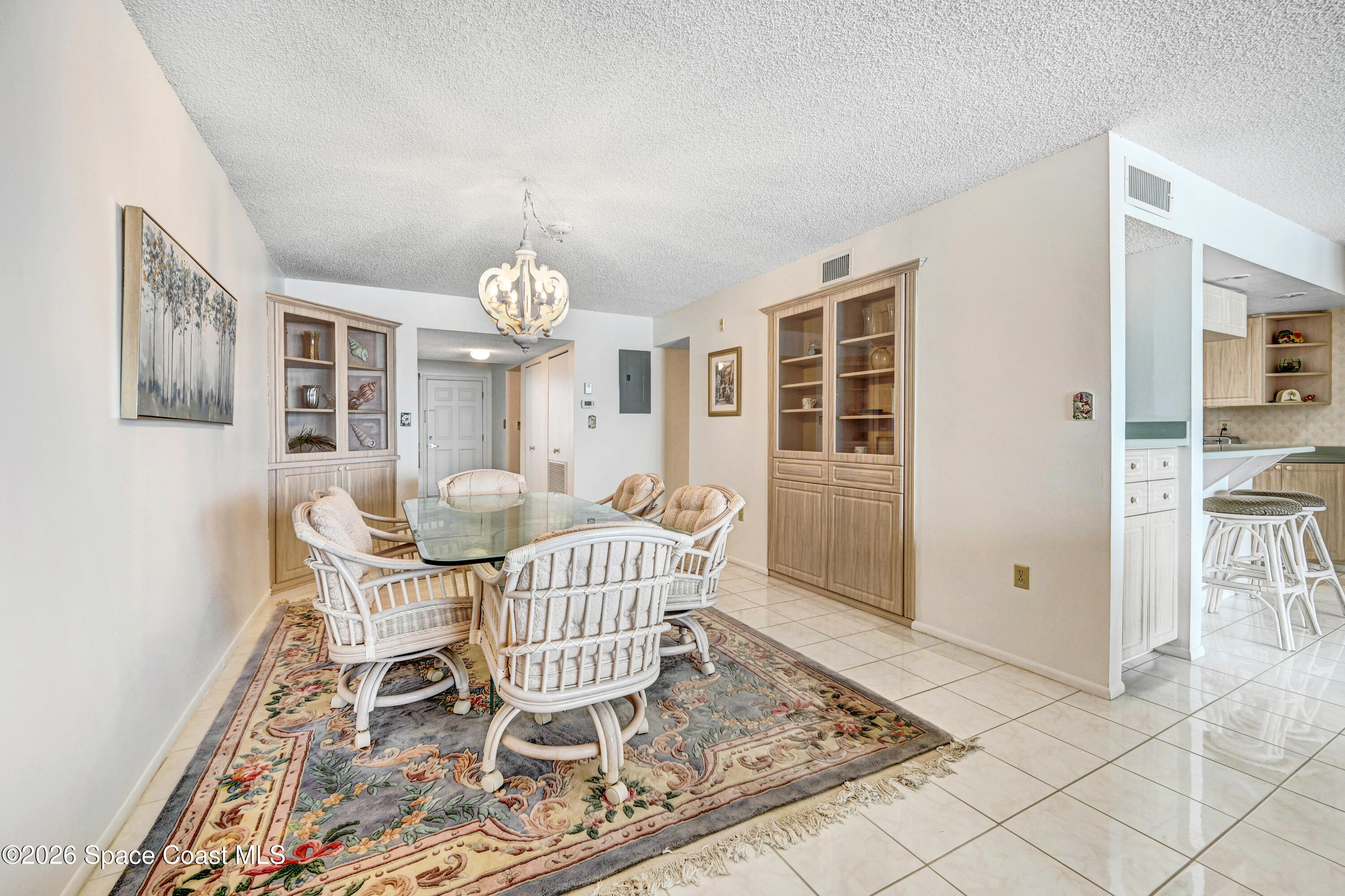 2101 Atlantic Street, Unit 533 Melbourne Beach, FL 32951 - Photo 15 of 51 a dining room with furniture and window