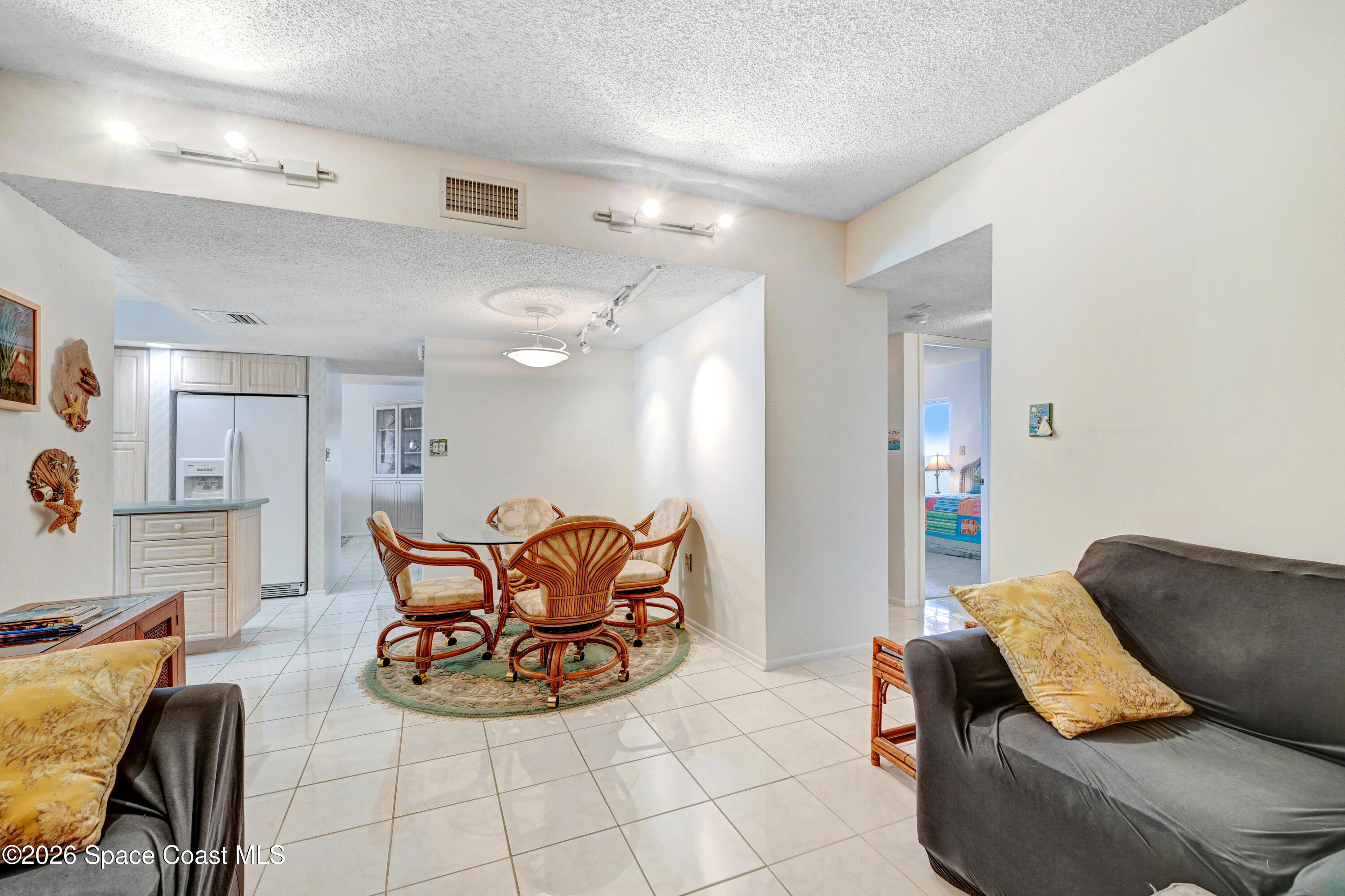 2101 Atlantic Street, Unit 533 Melbourne Beach, FL 32951 - Photo 26 of 51 a living room with furniture