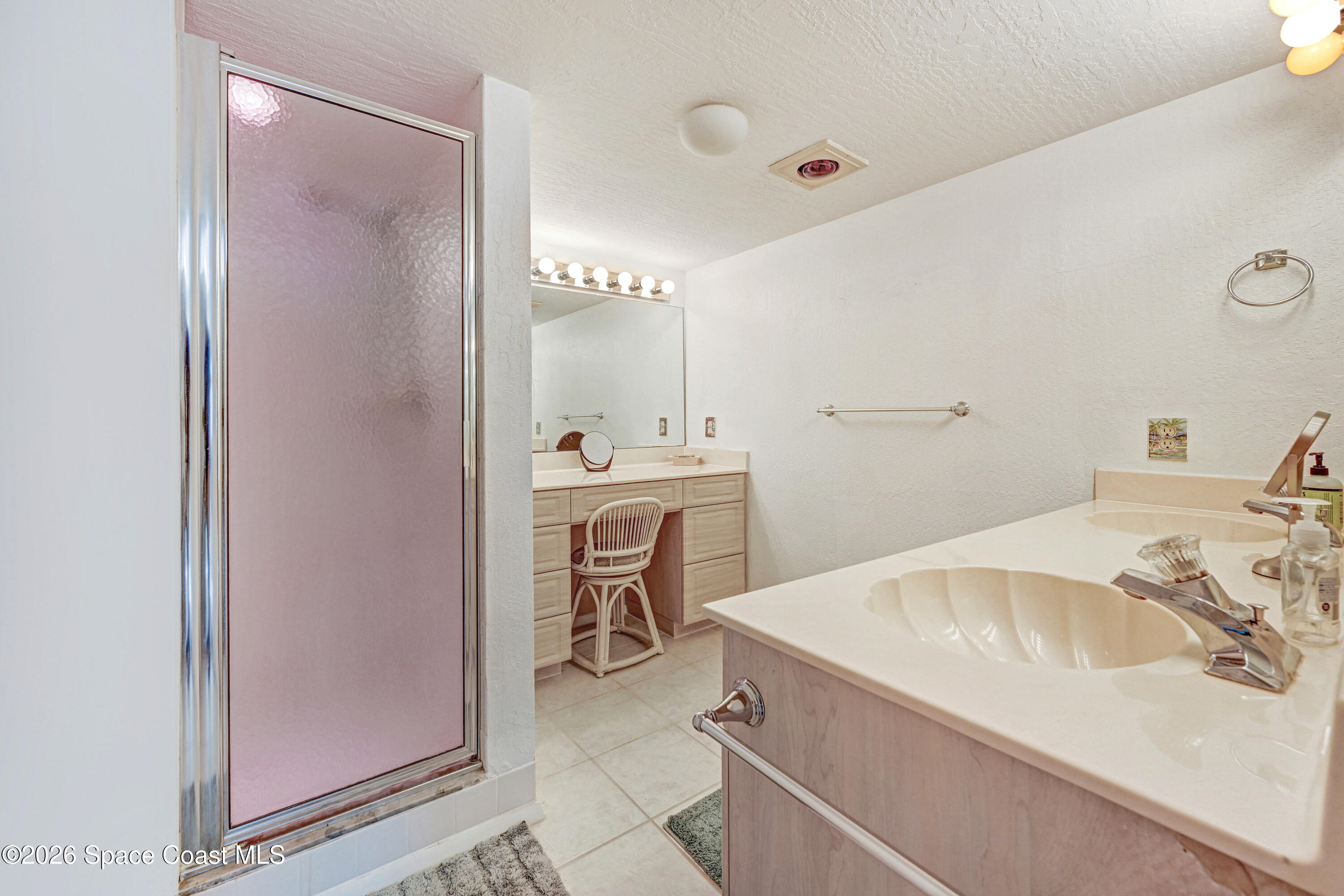 2101 Atlantic Street, Unit 533 Melbourne Beach, FL 32951 - Photo 34 of 51 a bathroom with a sink and a mirror