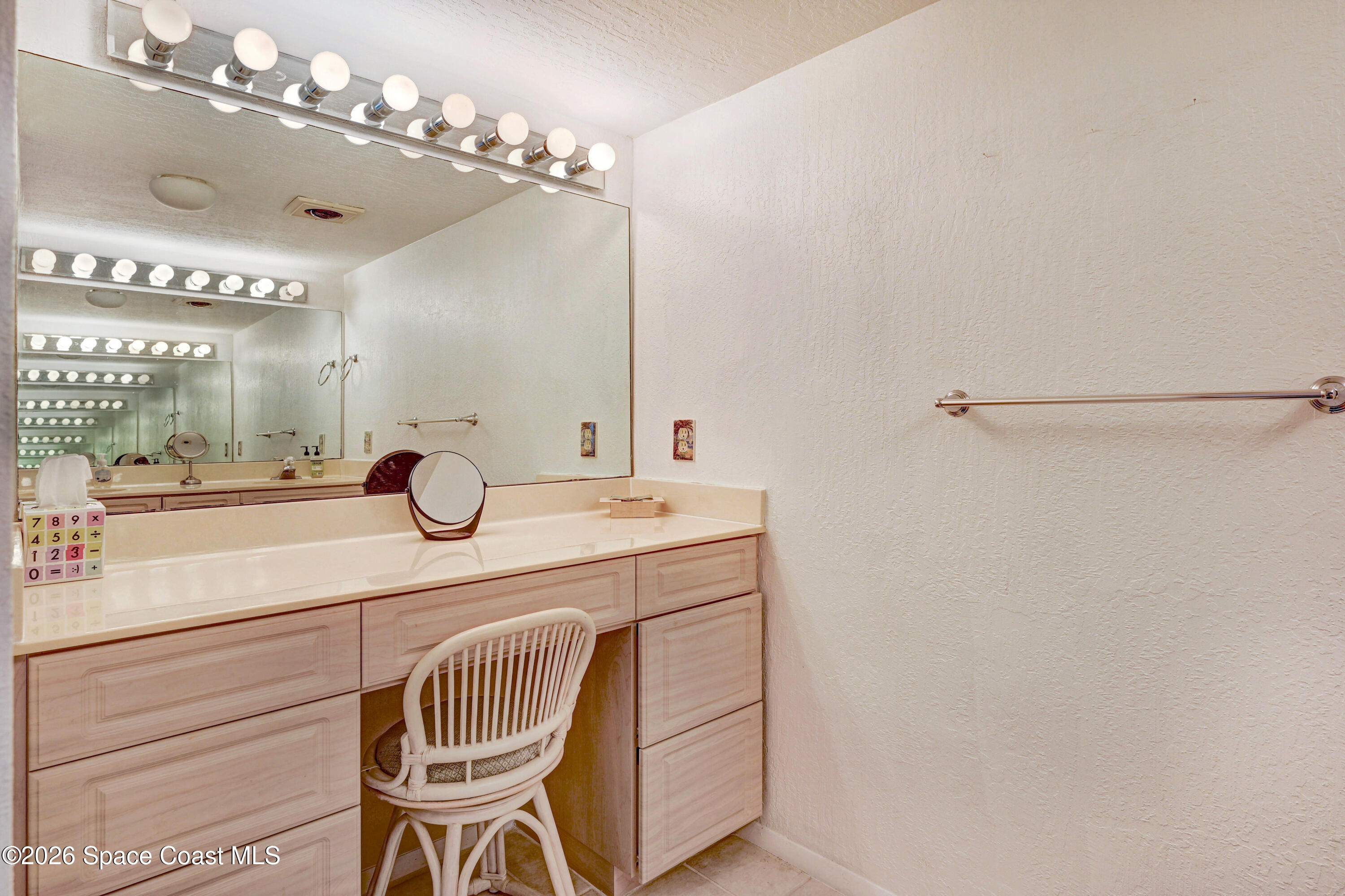 2101 Atlantic Street, Unit 533 Melbourne Beach, FL 32951 - Photo 36 of 51 a bathroom with a sink and a mirror