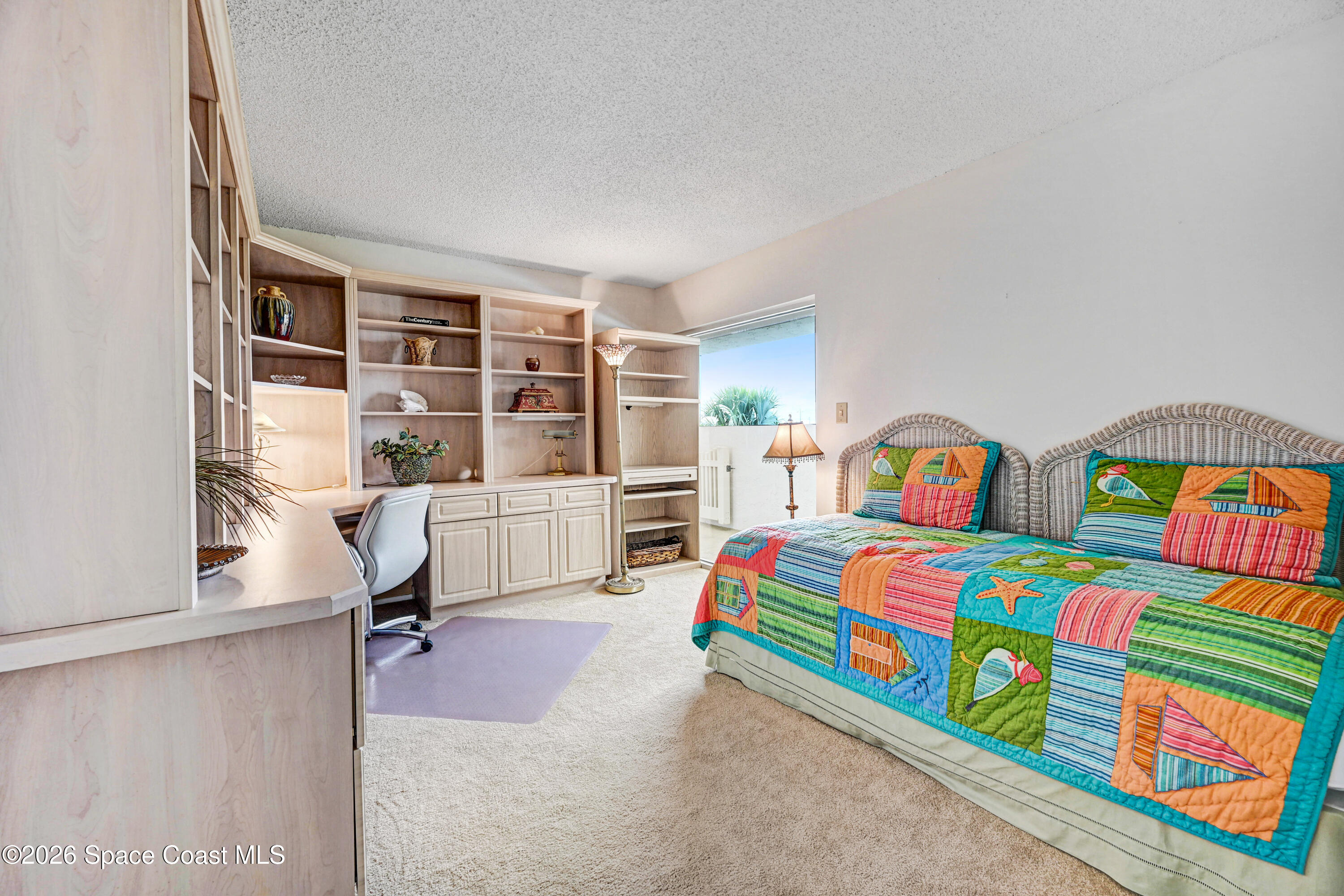 2101 Atlantic Street, Unit 533 Melbourne Beach, FL 32951 - Photo 40 of 51 a bedroom with a bed and a window