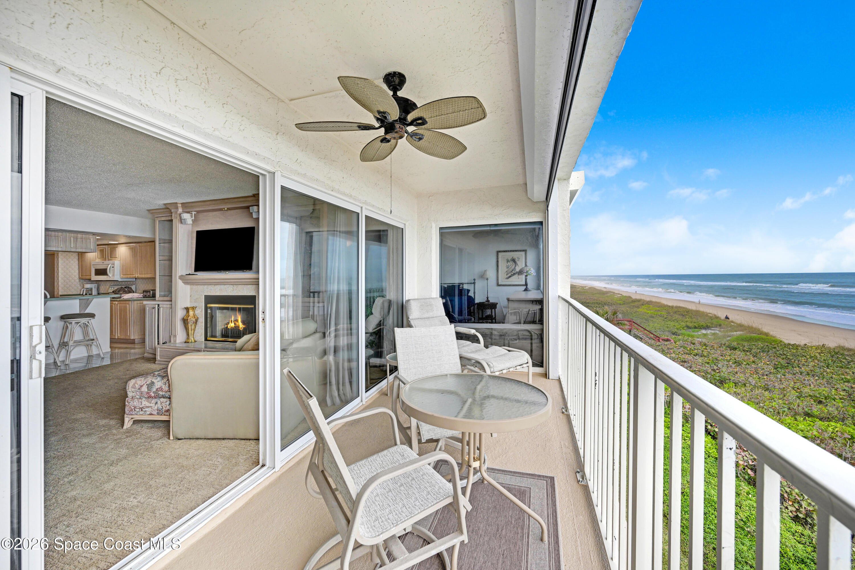 2101 Atlantic Street, Unit 533 Melbourne Beach, FL 32951 - Photo 49 of 51 a living room with furniture and a flat screen tv