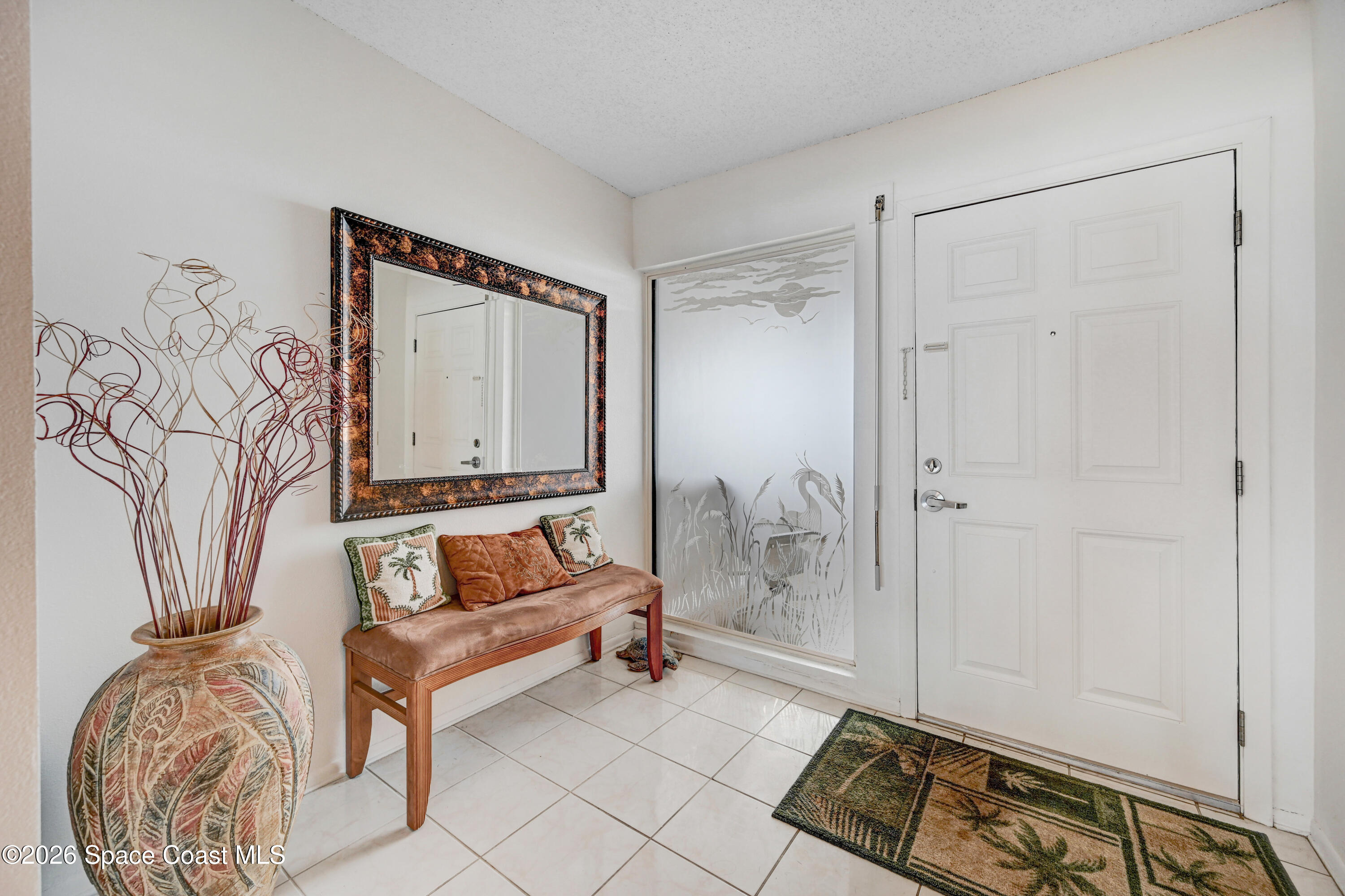 2101 Atlantic Street, Unit 533 Melbourne Beach, FL 32951 - Photo 10 of 51 a living room with furniture and a wooden floor