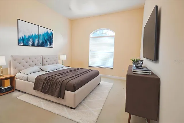 a bedroom with bed and window