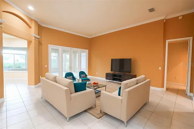 a living room with fireplace furniture and a flat screen tv