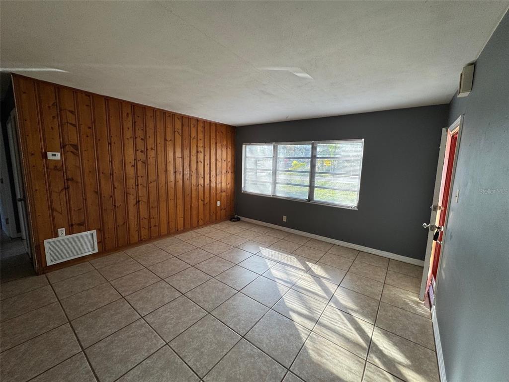 4023 Southwest 20th Street Gainesville, FL 32608 - Photo 8 of 10 a view of an empty room and window