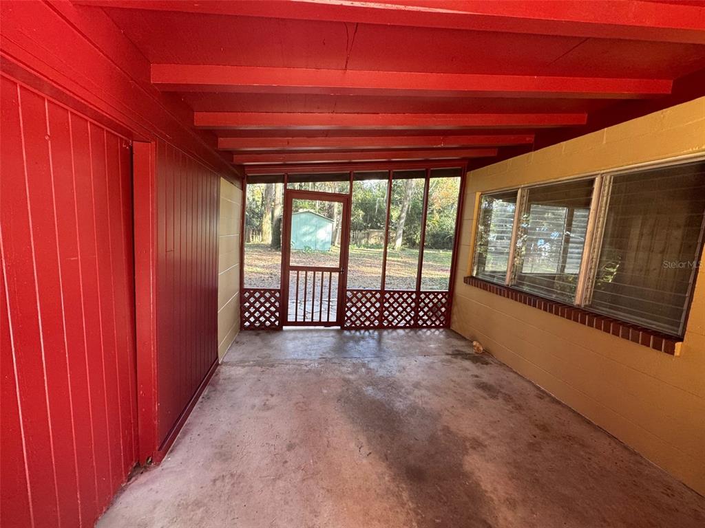 4023 Southwest 20th Street Gainesville, FL 32608 - Photo 10 of 10 a view of a room with exposed radiator and a wooden floor