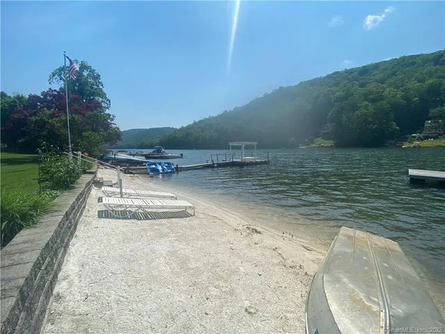 a view of a swimming pool with a yard
