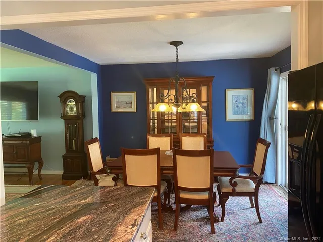 a workspace with furniture window and wooden floor