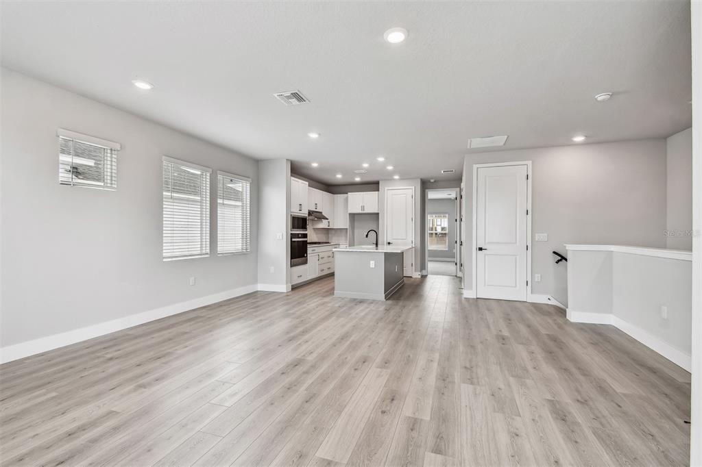 1631 Springwell Lane Sarasota, FL 34240 - Photo 14 of 43 a view of a kitchen with wooden floor and a window