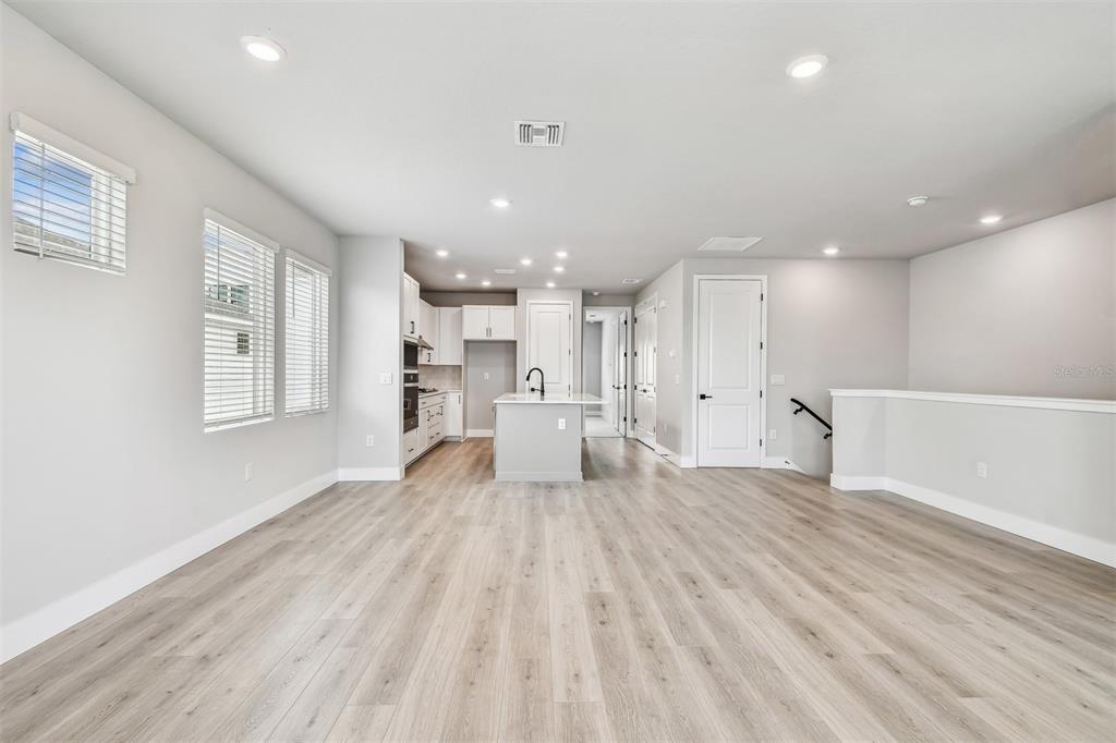 1631 Springwell Lane Sarasota, FL 34240 - Photo 15 of 43 a big room with wooden floor and windows
