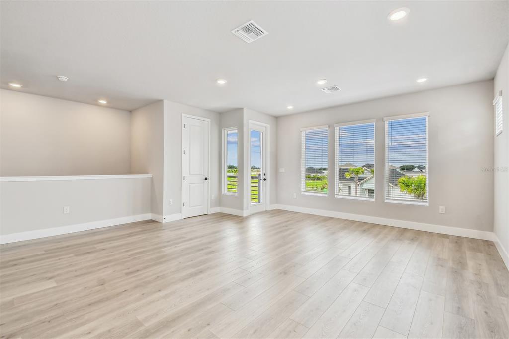 1631 Springwell Lane Sarasota, FL 34240 - Photo 17 of 43 a view of an empty room with a window