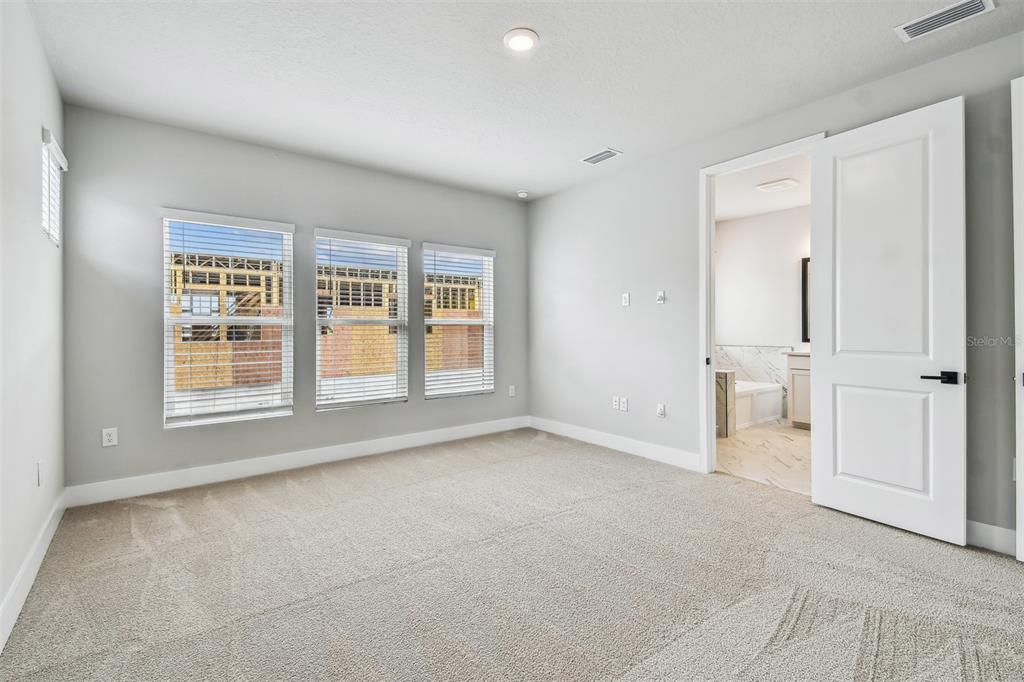 1631 Springwell Lane Sarasota, FL 34240 - Photo 22 of 43 a view of an empty room with a window