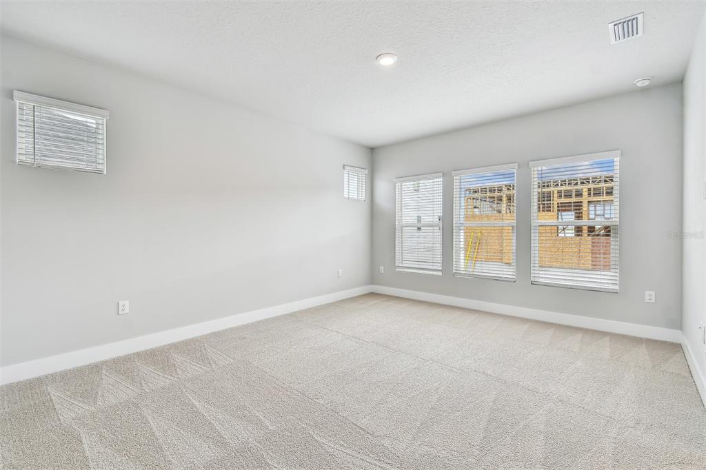 1631 Springwell Lane Sarasota, FL 34240 - Photo 23 of 43 an empty room with windows