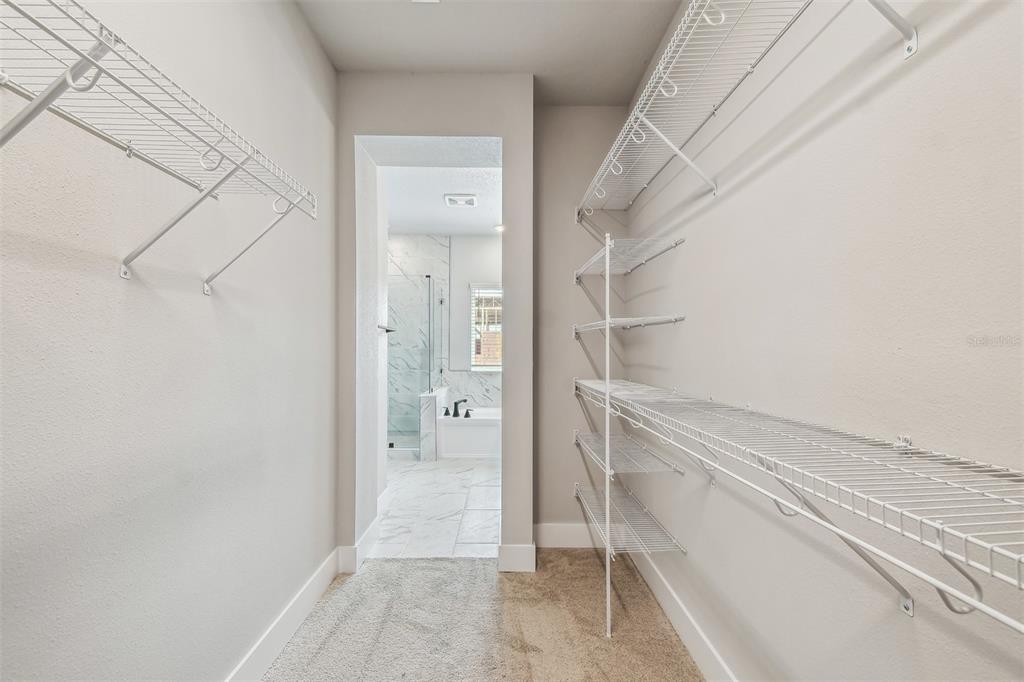 1631 Springwell Lane Sarasota, FL 34240 - Photo 29 of 43 a bathroom with a shower and a sink