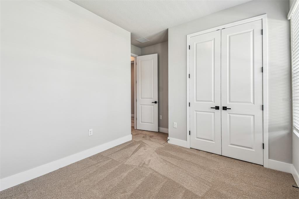 1631 Springwell Lane Sarasota, FL 34240 - Photo 31 of 43 an empty room with window