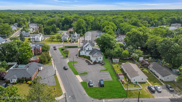 an aerial view of a house with outdoor space and garden
