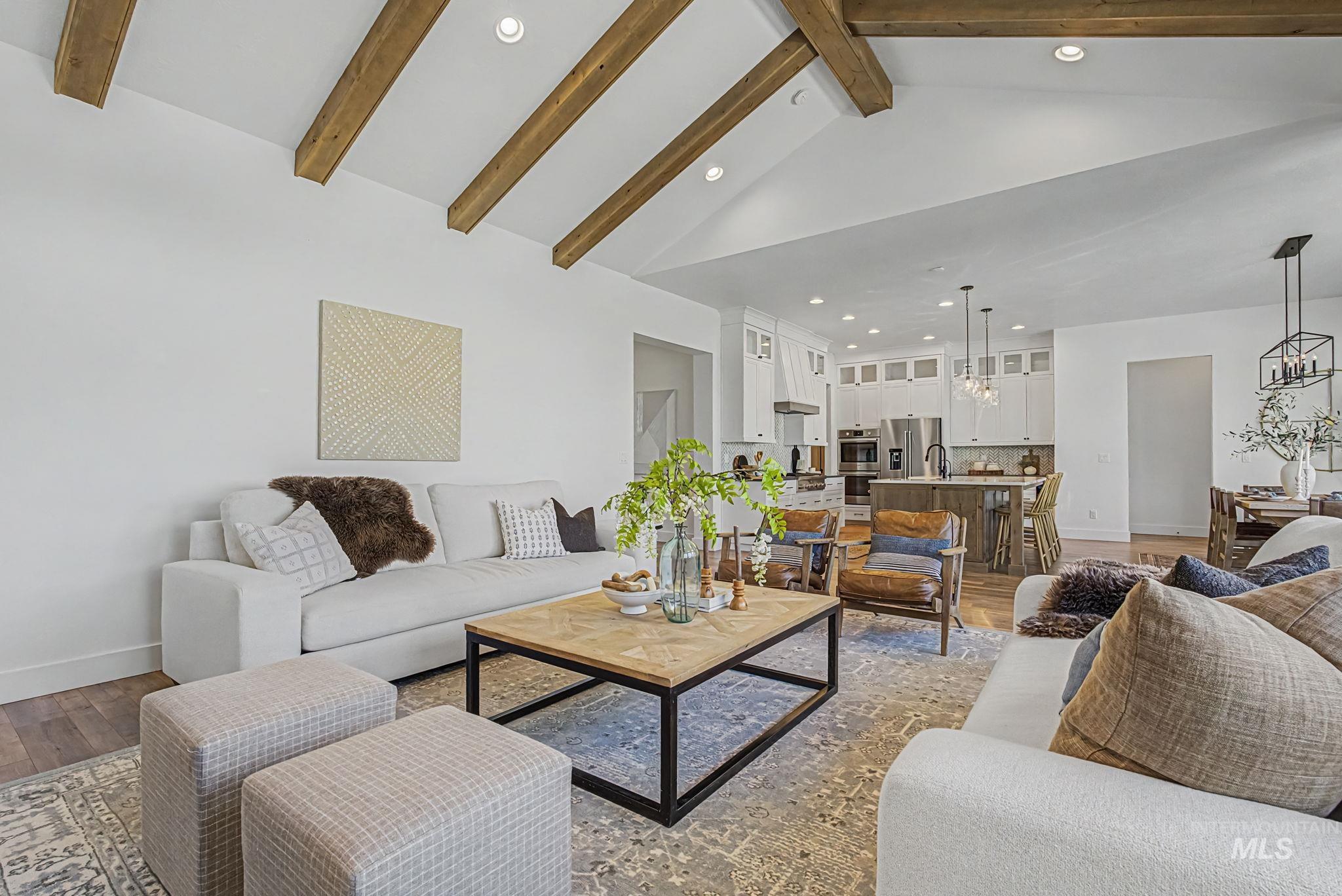6521 South Pemberley Way Meridian, ID 83642 - Photo 14 of 42 Vaulted ceiling featuring exposed wood beams and recessed lighting