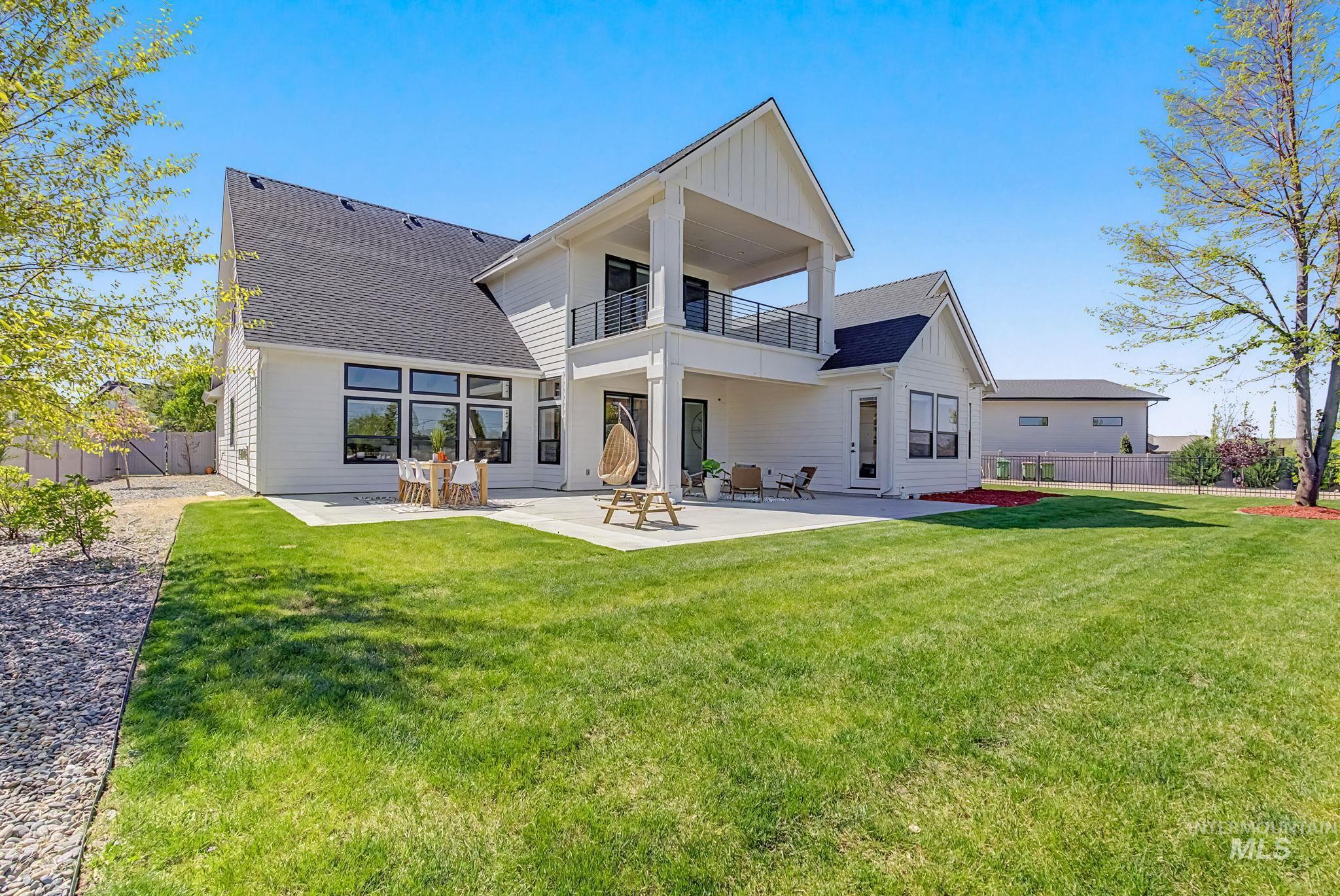 6521 South Pemberley Way Meridian, ID 83642 - Photo 32 of 42 Contemporary home exterior with white siding and dark shingle roofing