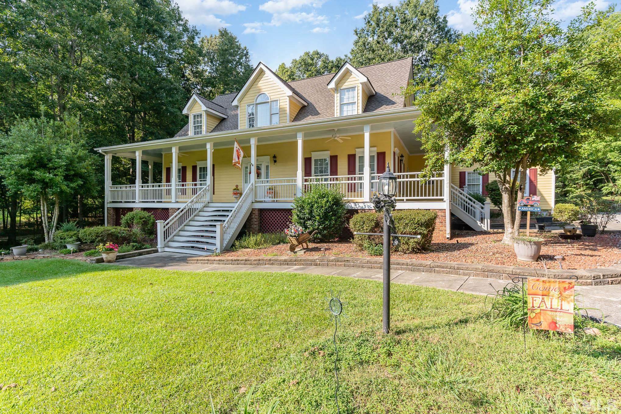 6913 Pinnacle Ridge Road Raleigh, NC 27603 - Photo 1 of 34 a view of a house with backyard and garden