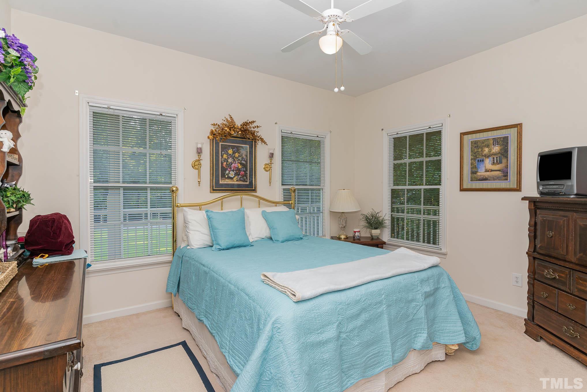 6913 Pinnacle Ridge Road Raleigh, NC 27603 - Photo 15 of 34 a bedroom with a bed and furniture