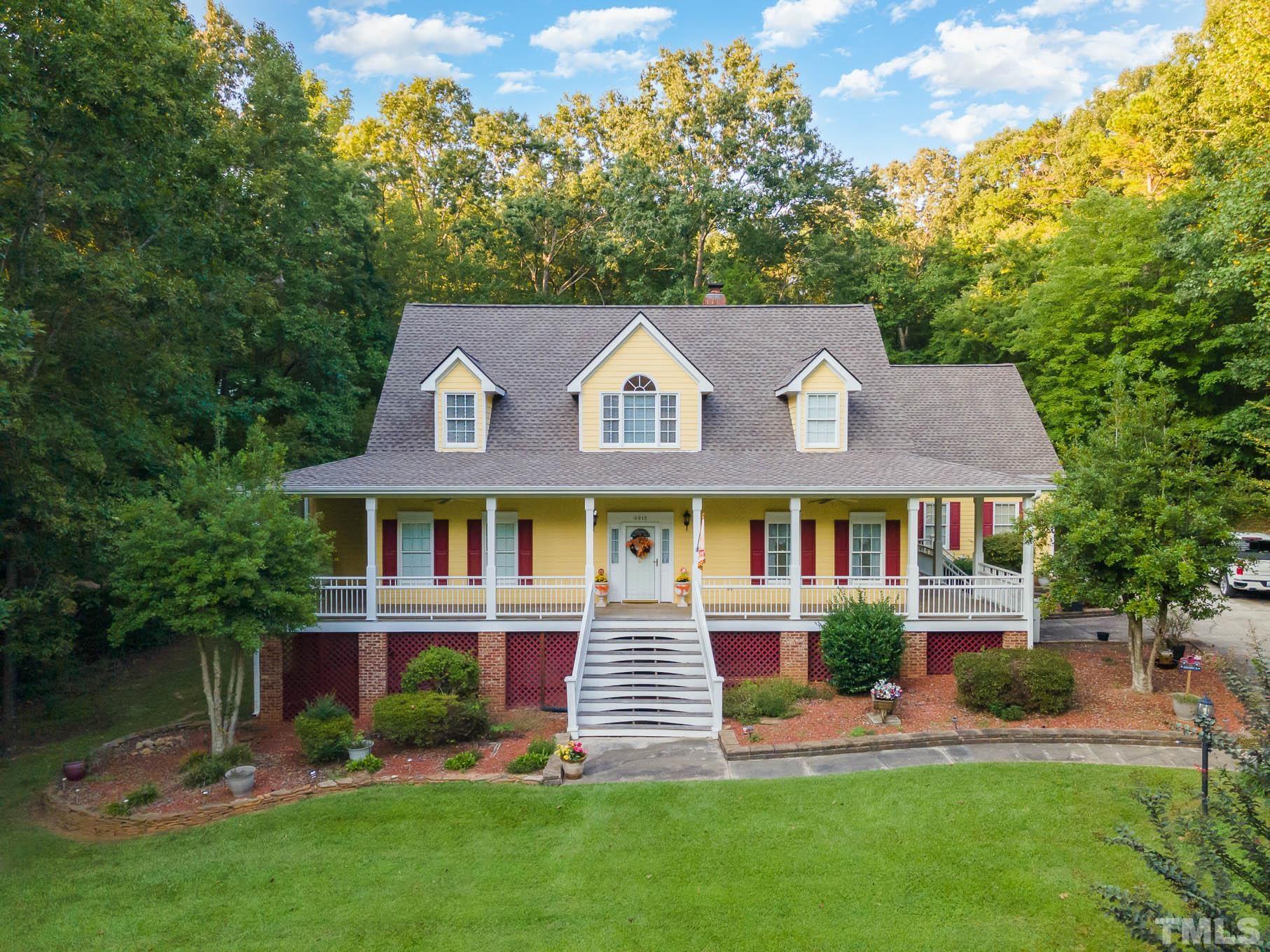6913 Pinnacle Ridge Road Raleigh, NC 27603 - Photo 30 of 34 front view of a house with a yard