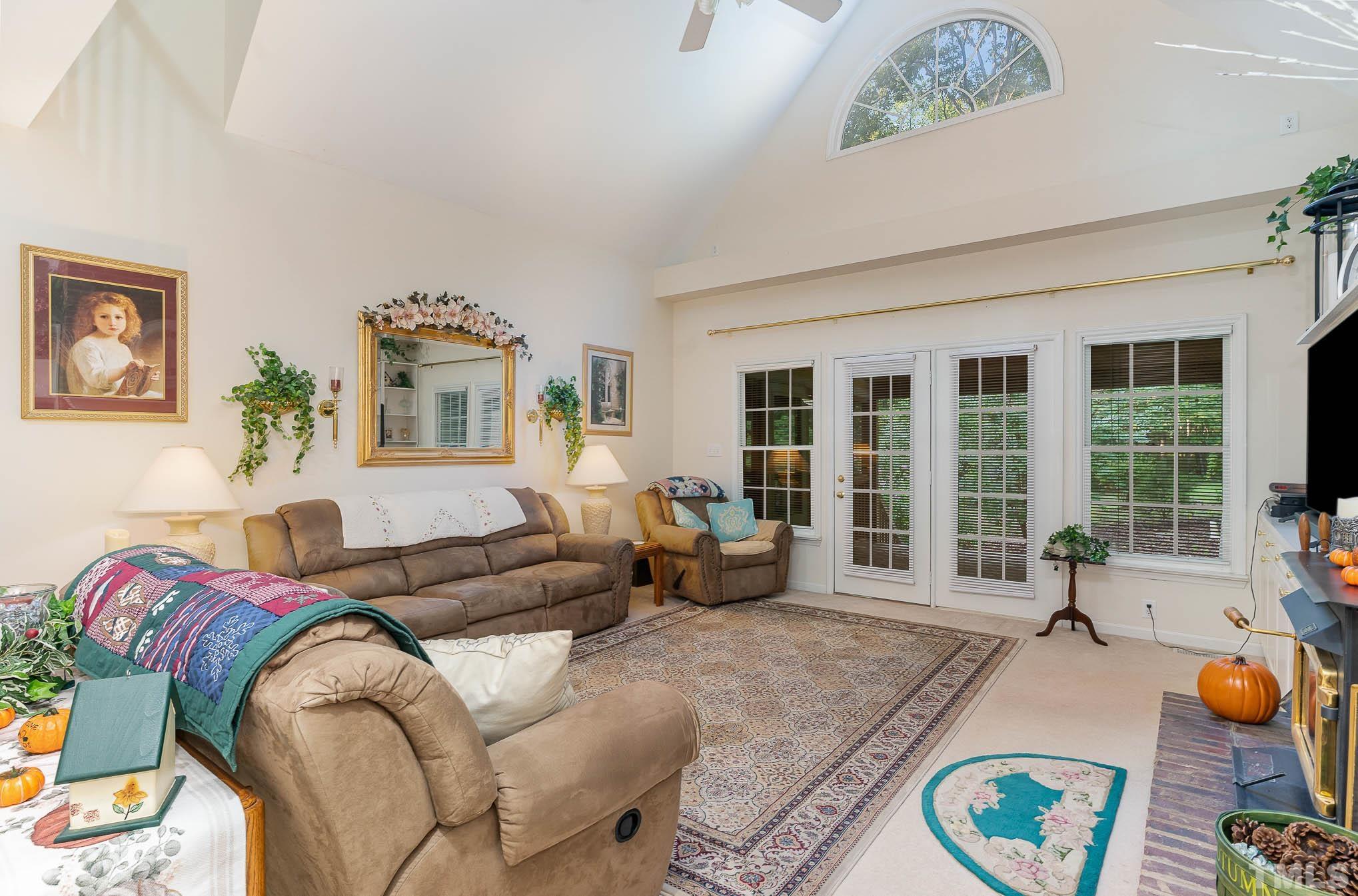 6913 Pinnacle Ridge Road Raleigh, NC 27603 - Photo 8 of 34 a living room with furniture and a large window