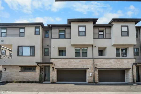 a front view of a house with yard