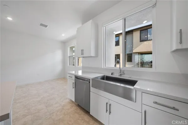 a kitchen that has a sink and a stove