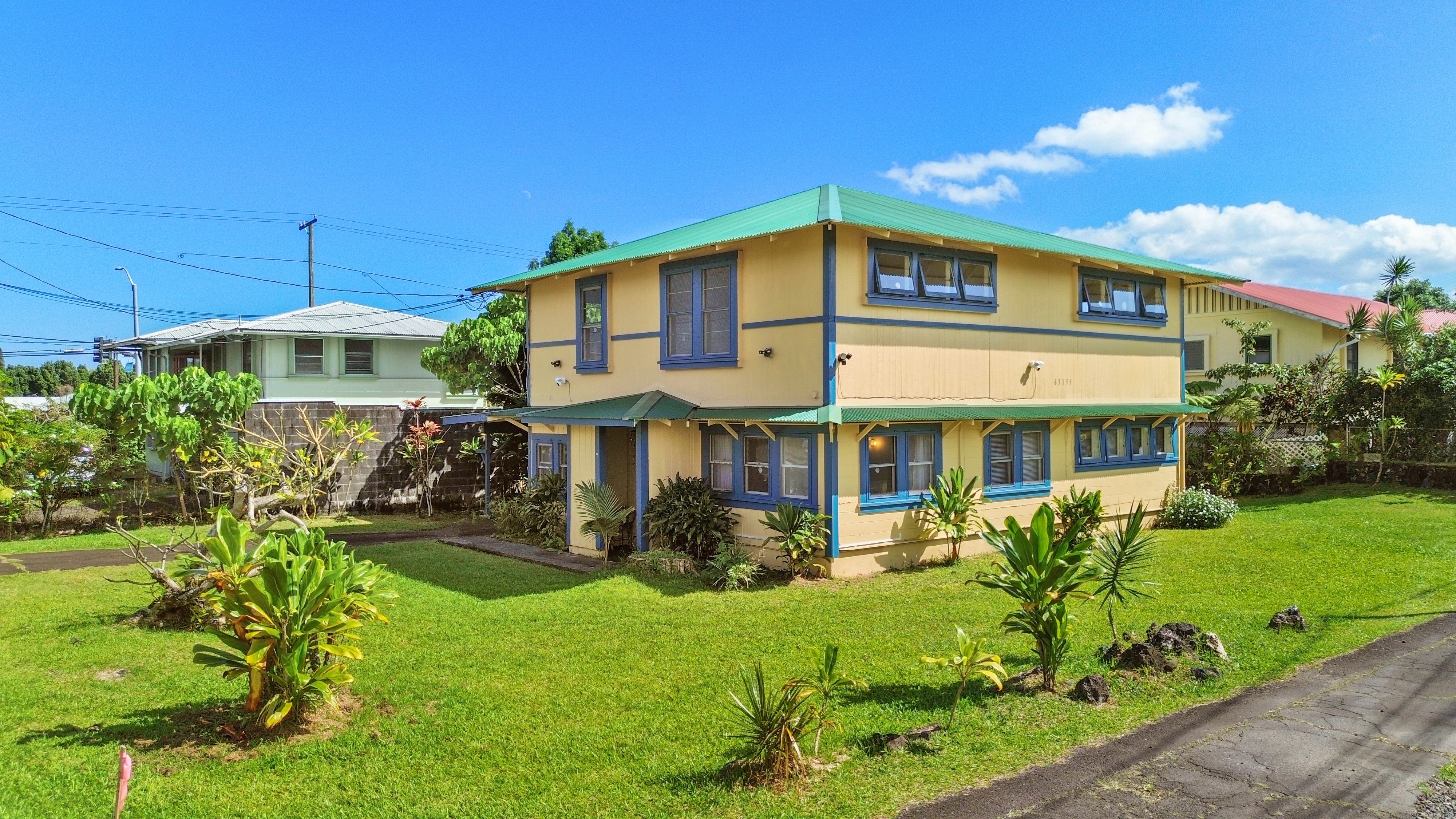 a front view of a house with garden