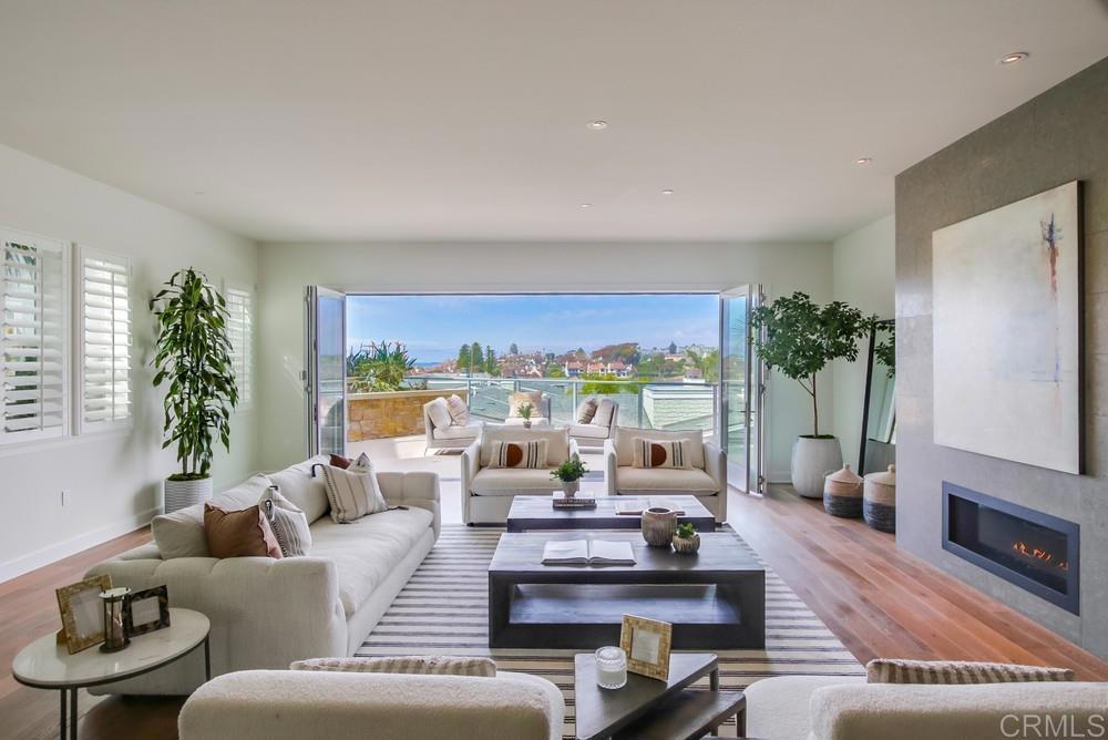 2333 Ocean Street Carlsbad, CA 92008 - Photo 12 of 67 a living room with furniture large window and flat screen tv