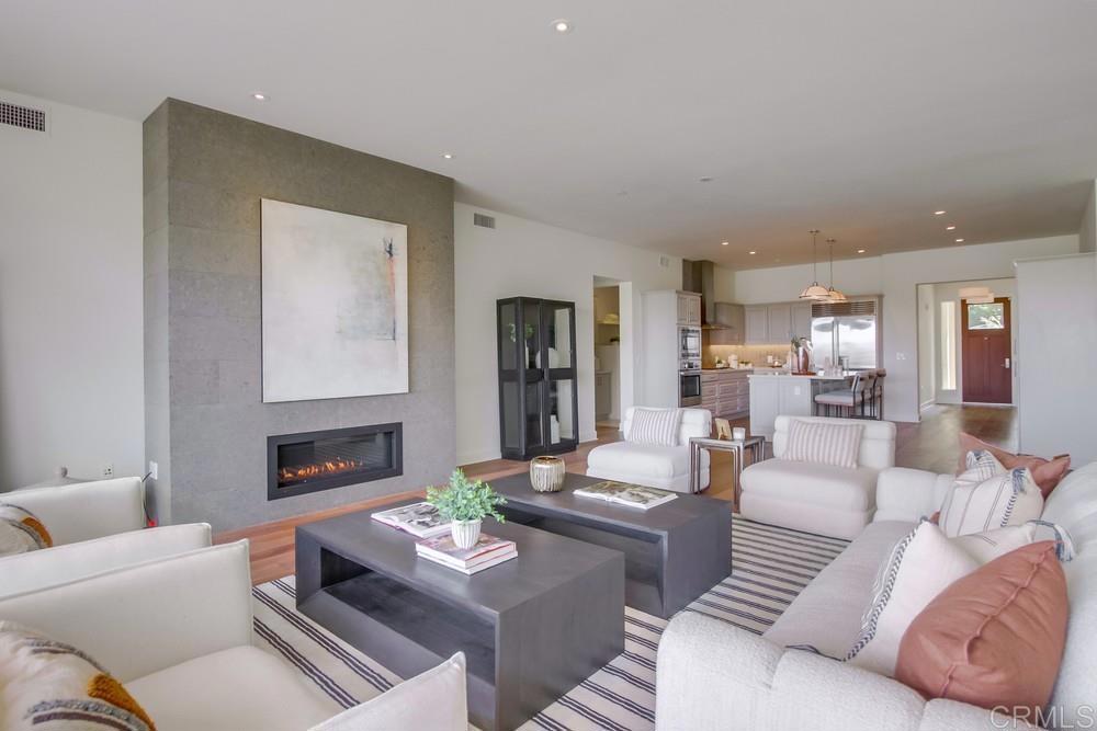 2333 Ocean Street Carlsbad, CA 92008 - Photo 13 of 67 a living room with furniture and a fireplace