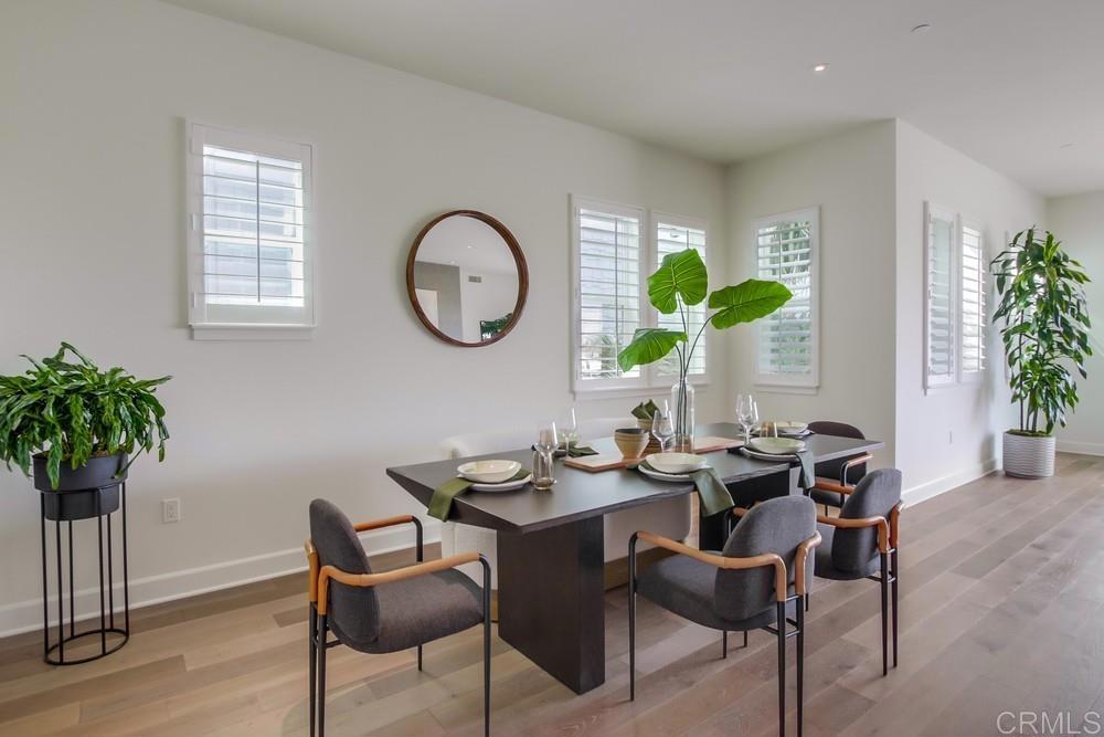 2333 Ocean Street Carlsbad, CA 92008 - Photo 15 of 67 a dining room with furniture and a potted plant