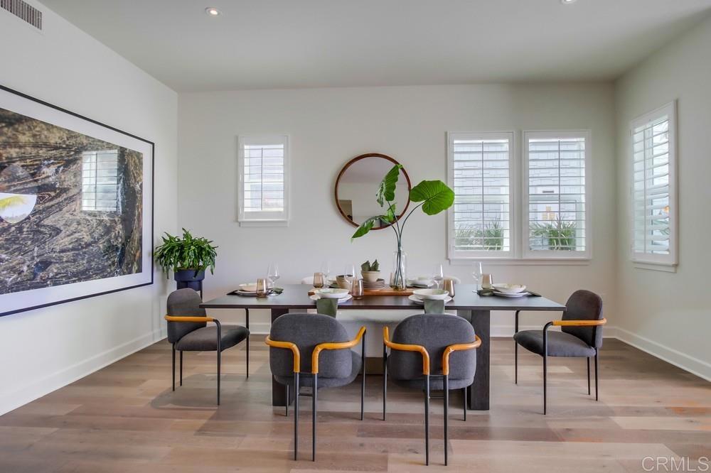 2333 Ocean Street Carlsbad, CA 92008 - Photo 16 of 67 a view of a dining room with furniture window and wooden floor