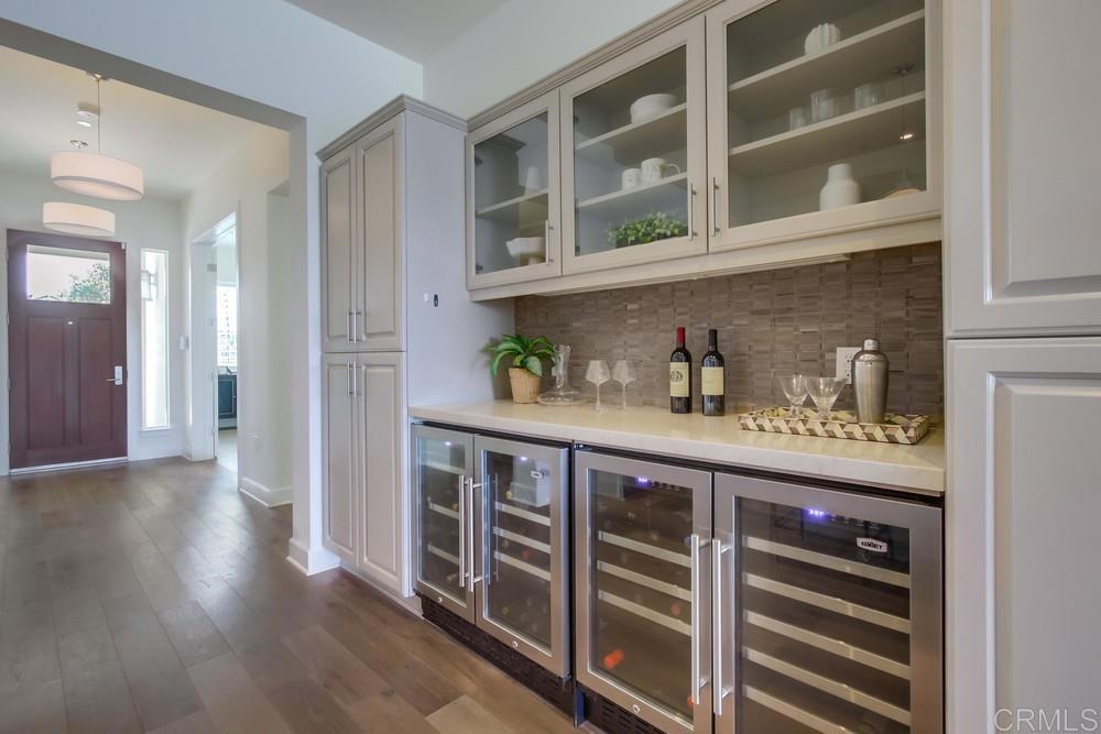 2333 Ocean Street Carlsbad, CA 92008 - Photo 17 of 67 a kitchen with stainless steel appliances a cabinets and wooden floor