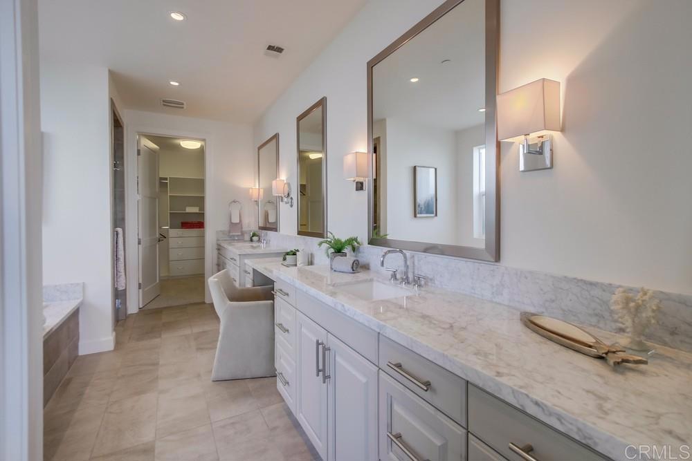 2333 Ocean Street Carlsbad, CA 92008 - Photo 23 of 67 a spacious bathroom with a granite countertop sink a mirror and a