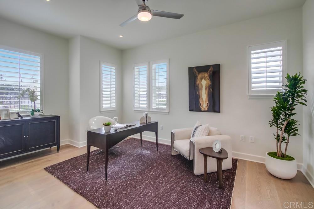 2333 Ocean Street Carlsbad, CA 92008 - Photo 27 of 67 a living room with furniture and a potted plant