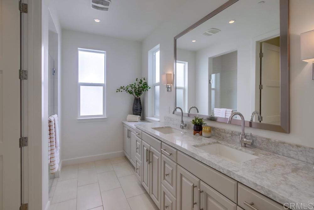 2333 Ocean Street Carlsbad, CA 92008 - Photo 34 of 67 a bathroom with double vanity and a mirror