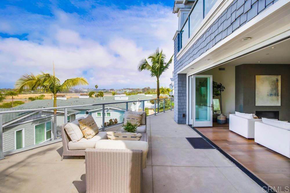 2333 Ocean Street Carlsbad, CA 92008 - Photo 39 of 67 a view of a chairs and table in patio with potted plants