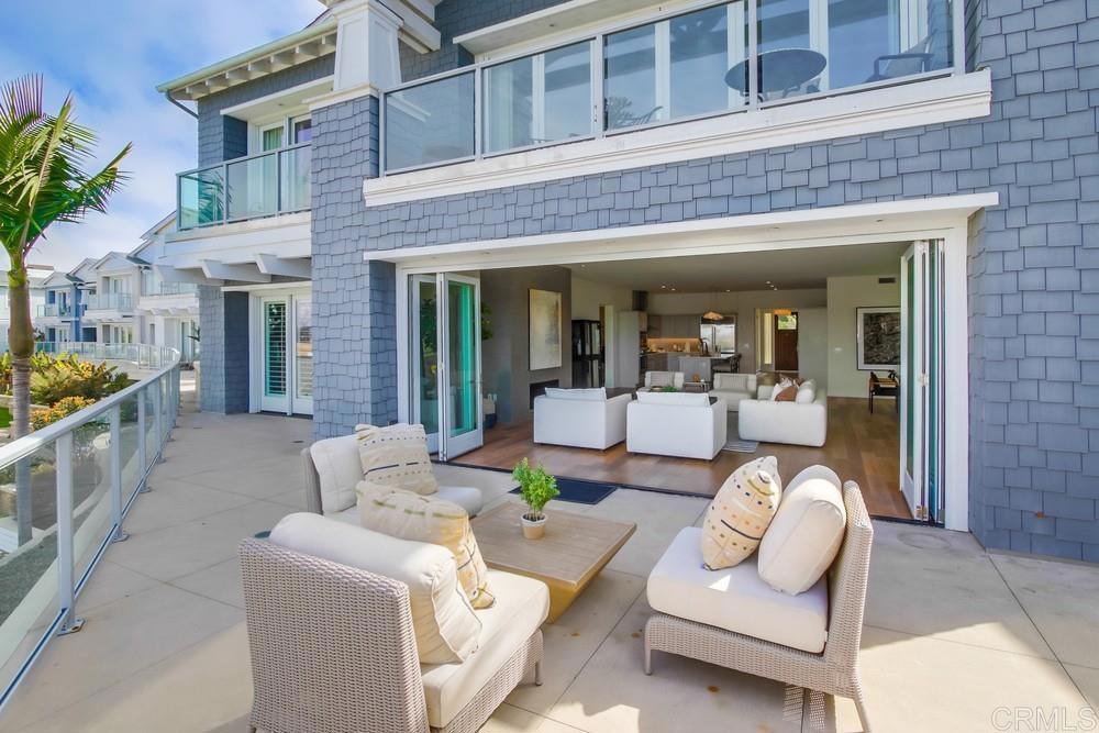 2333 Ocean Street Carlsbad, CA 92008 - Photo 40 of 67 a view of a patio with couches table and chairs and potted plants