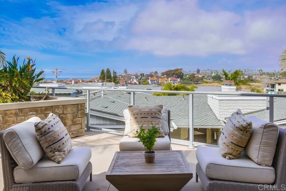 2333 Ocean Street Carlsbad, CA 92008 - Photo 43 of 67 a view of a balcony with furniture and a potted plant