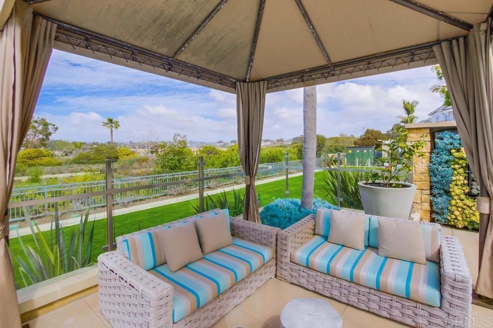 2333 Ocean Street Carlsbad, CA 92008 - Photo 53 of 67 a view of a patio with couches chairs dining table and chairs