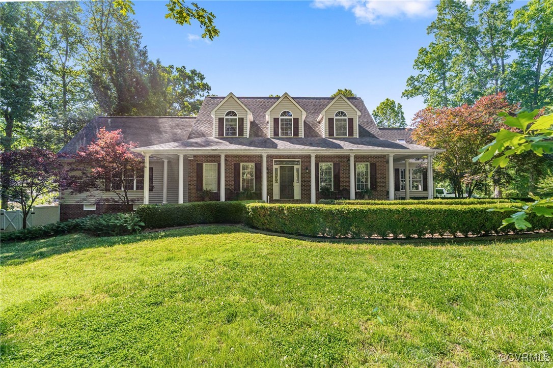 1391 Quarter Mill Court Powhatan, VA 23139 - Photo 1 of 34 a front view of a house with a garden